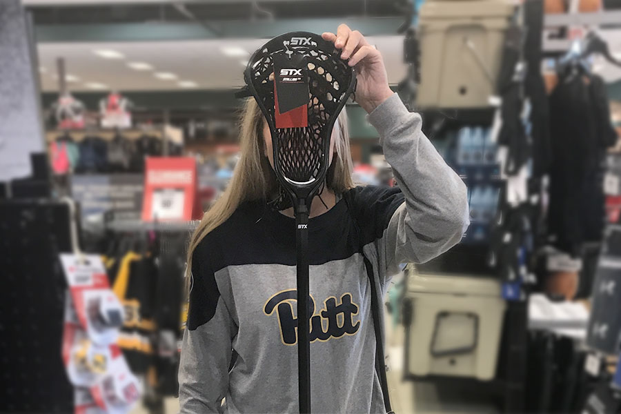 Moe covering face in sports store